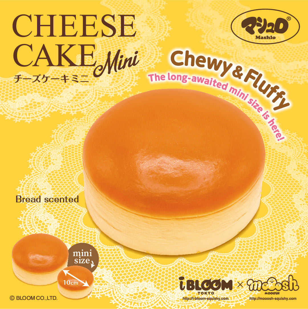 A yellow retail package graphic for a mini cheese cake squishy by the brand IBLOOM. The package shows a round, pale beige cake with a glossy amber-orange top, plus smaller inset views of the mini cake and text reading 'CHEESE CAKE Mini,' 'Chewy & Fluffy,' 'Bread scented,' and '10cm. 