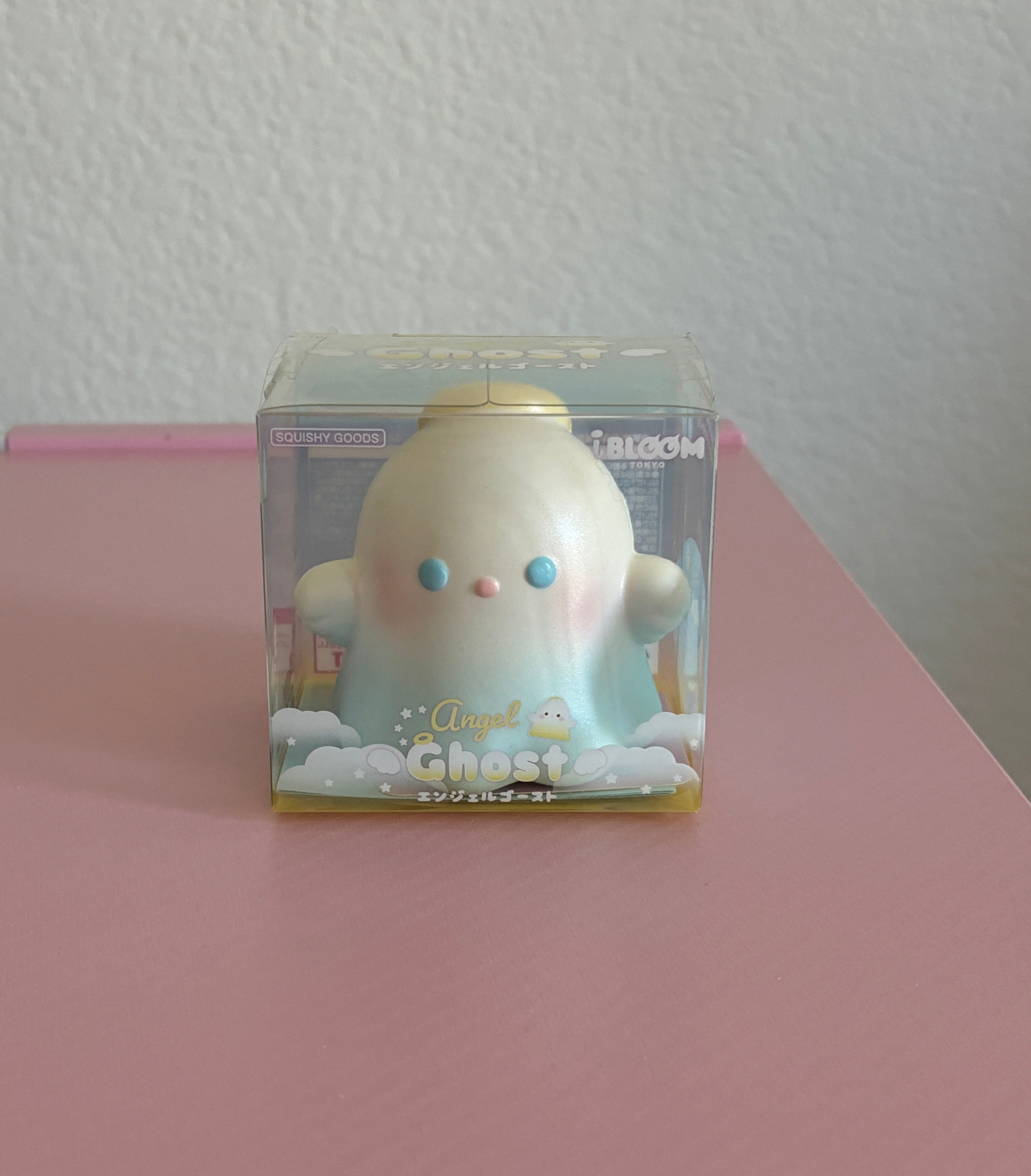 Ibloom angel ghost squishy in ibloom branded box against pink background